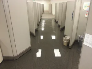 Flooded hallway with standing water requiring water damage restoration