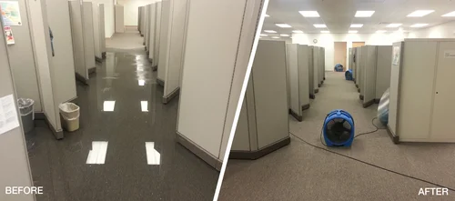 Flooded hallway with standing water during water damage restoration