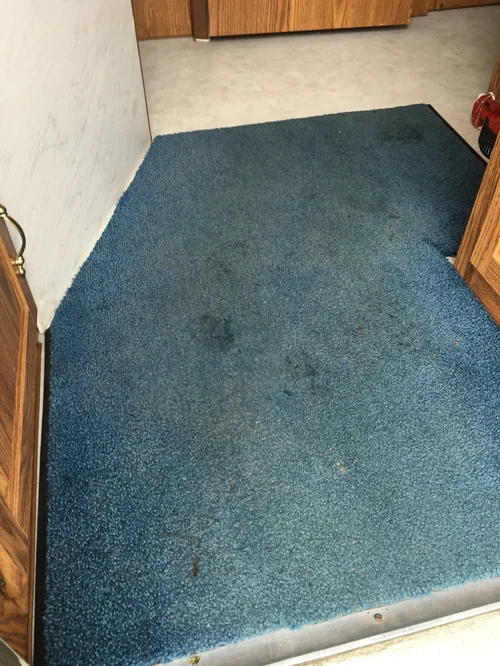 Carpeted room before and after cleaning or restoration process