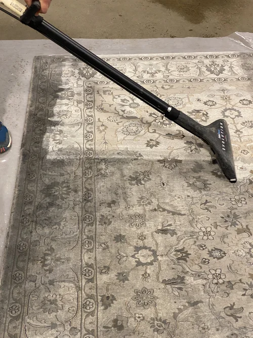 Carpet cleaning extraction tool removing dirt and moisture from flooring