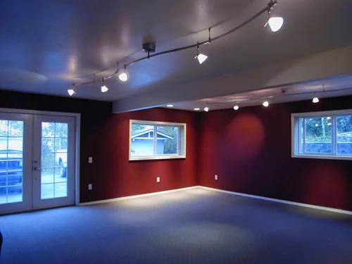 Finished interior space with lighting after renovation or restoration