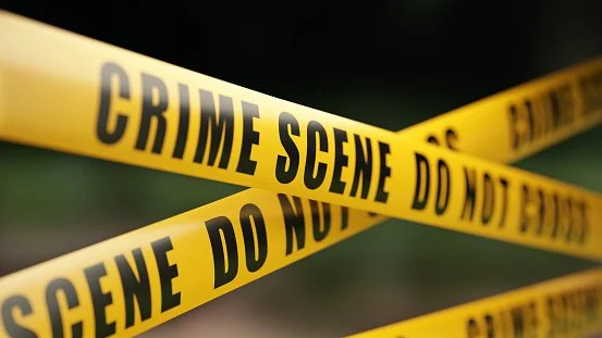Crime scene tape indicating biohazard or trauma cleanup area