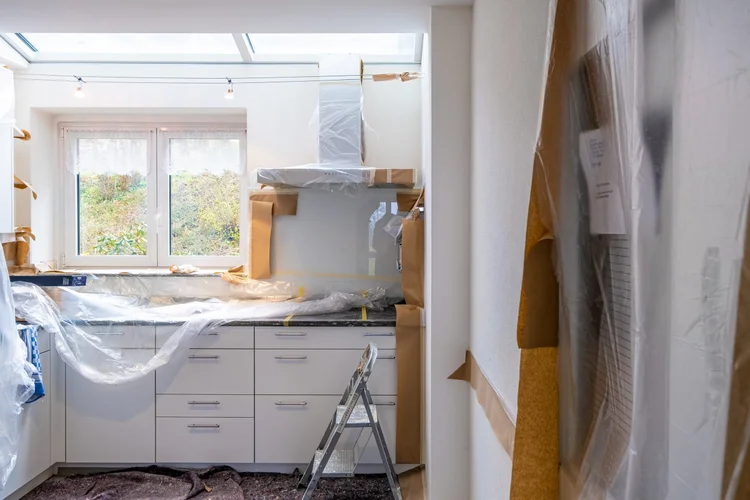 Interior space under renovation with unfinished walls and flooring